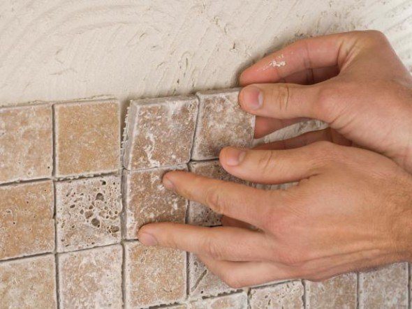 Installing a tile a tile backsplash