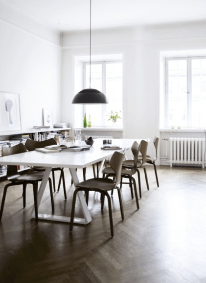 modern white dining table with wooden chairs