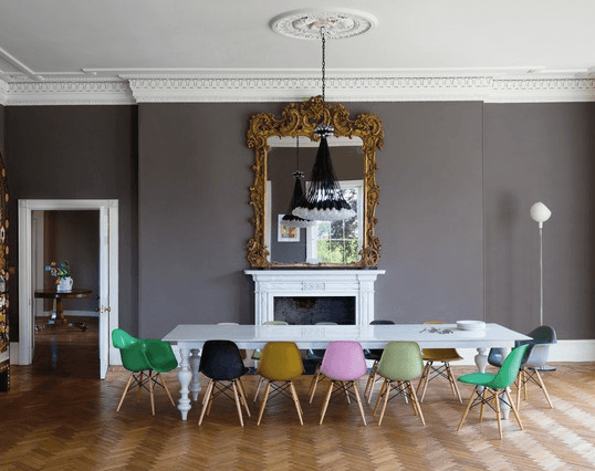 white dining table and coloured chairs