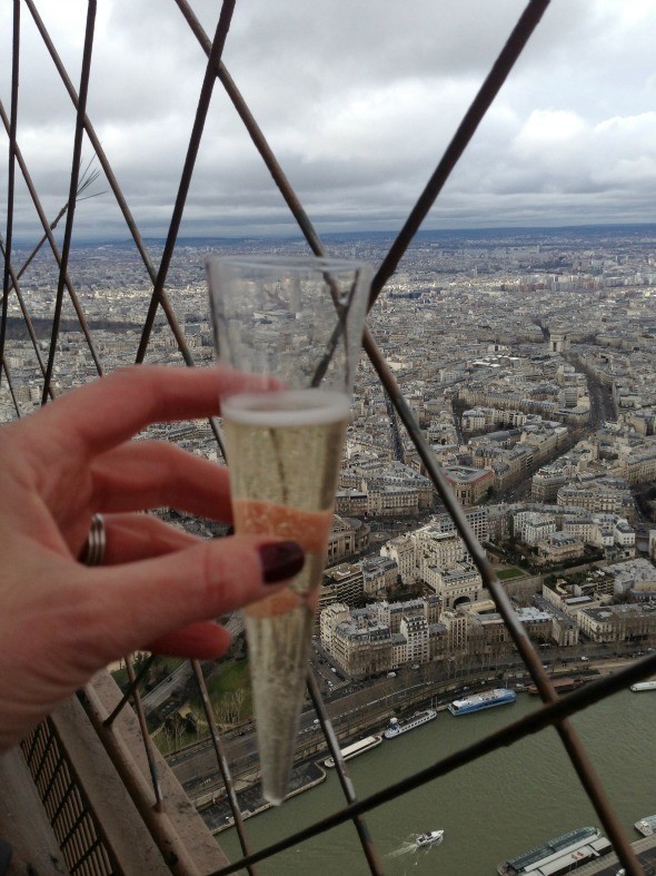 Drinking champagne while visiting the summit of the Eiffel Tower 