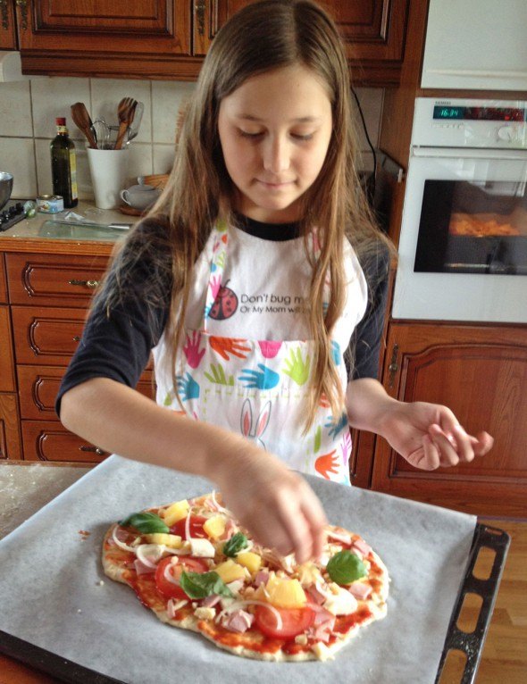 Gabriella making pizza on our regular make-your-own-pizza night.
