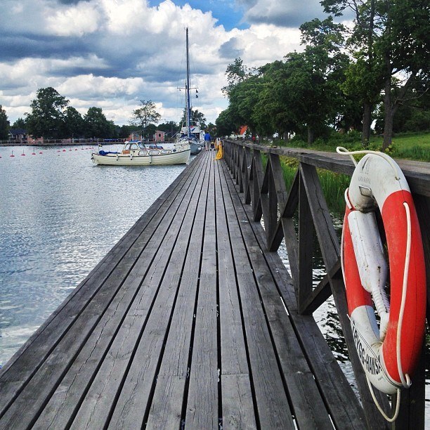 boats in a dock Vadstena | Instagram travel photo by skimbaco http://instagram.com/skimbaco