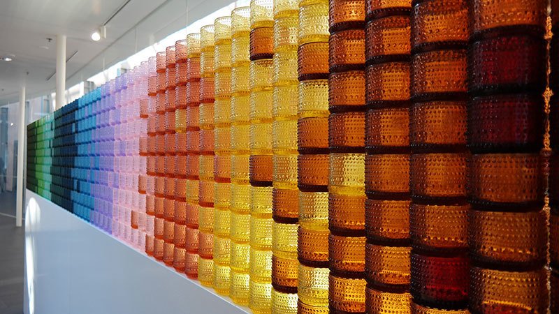 colorful glass votive installation created with iittala's candle votives. 
