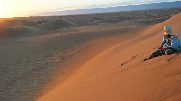 We climbed up on the sand dunes to watch the sunset over Sahara. 