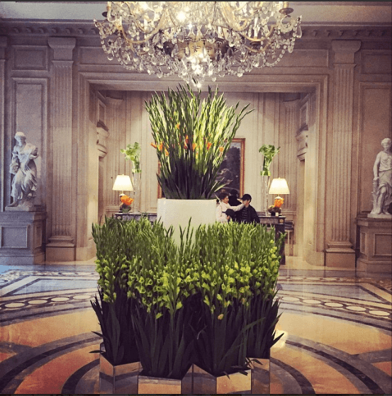 Hotel George V, on Avenue George V just off of Avenue Montaigne. The lobby of this Four Seasons property is always beautifully adorned with fresh flowers daily, and the garden is a posh, serene spot to grab an aperitif.