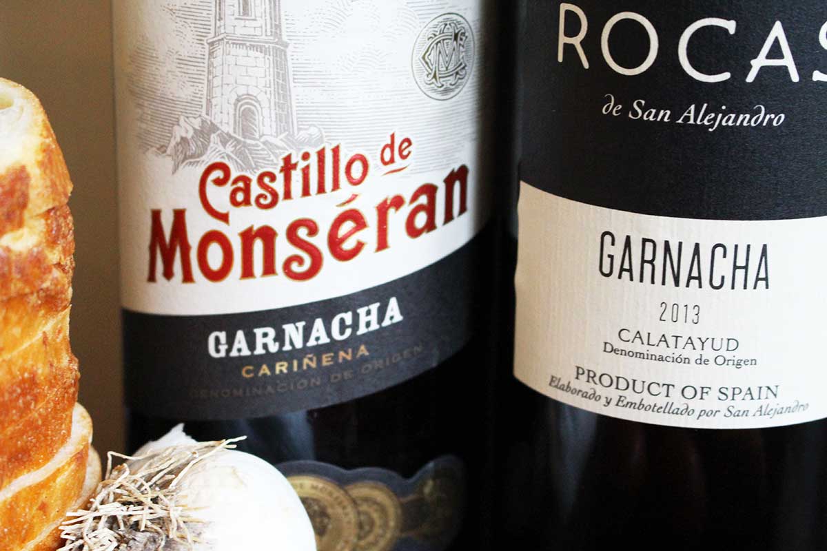 Learn about Garnacha, where to find it in Spain, our first impressions of Garnacha wine, and suggestions how to serve the Garnacha wine with a traditional Catalan dish for friends.